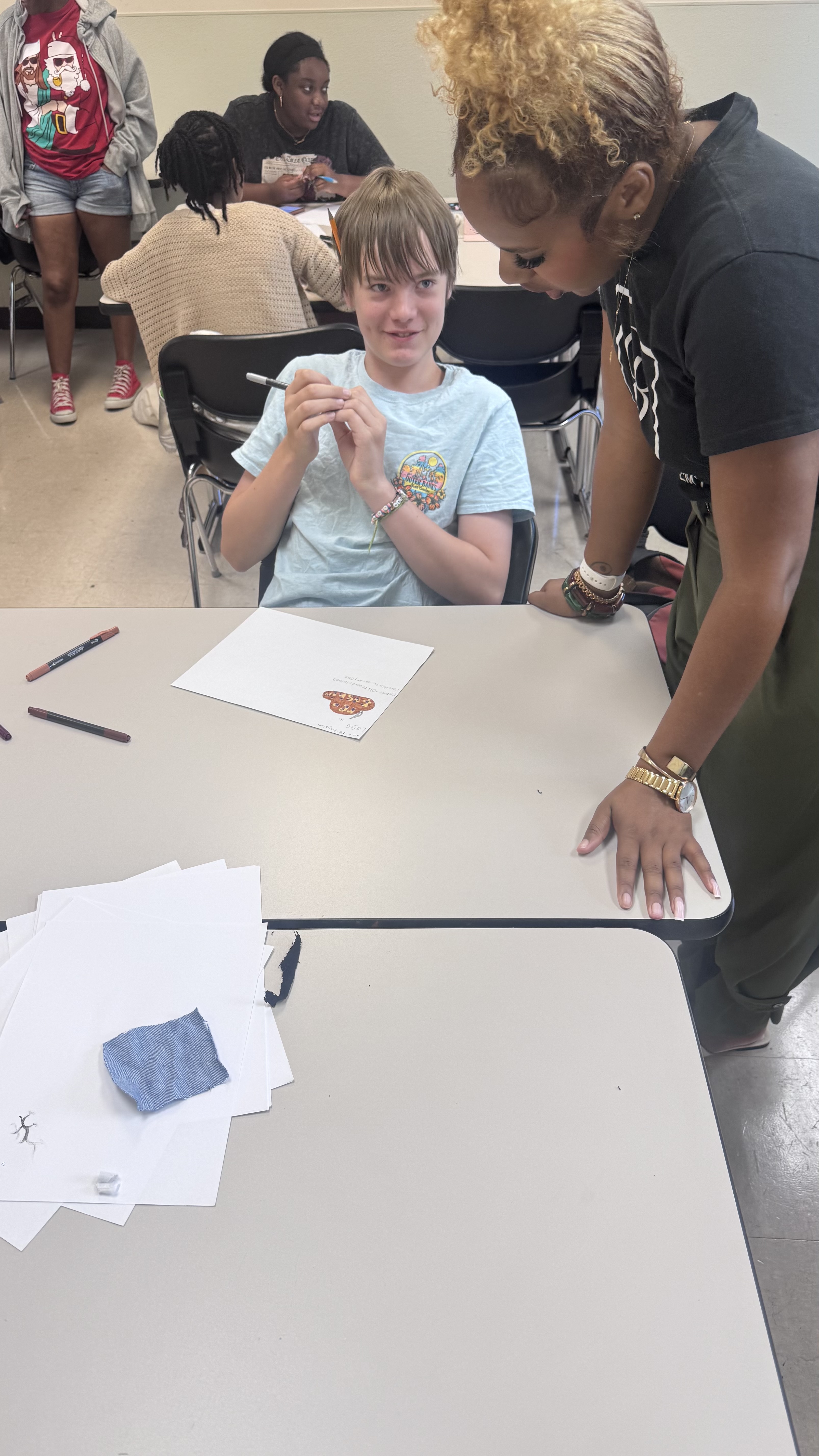 CBA instructor working one-on-one with a student on a hands-on project