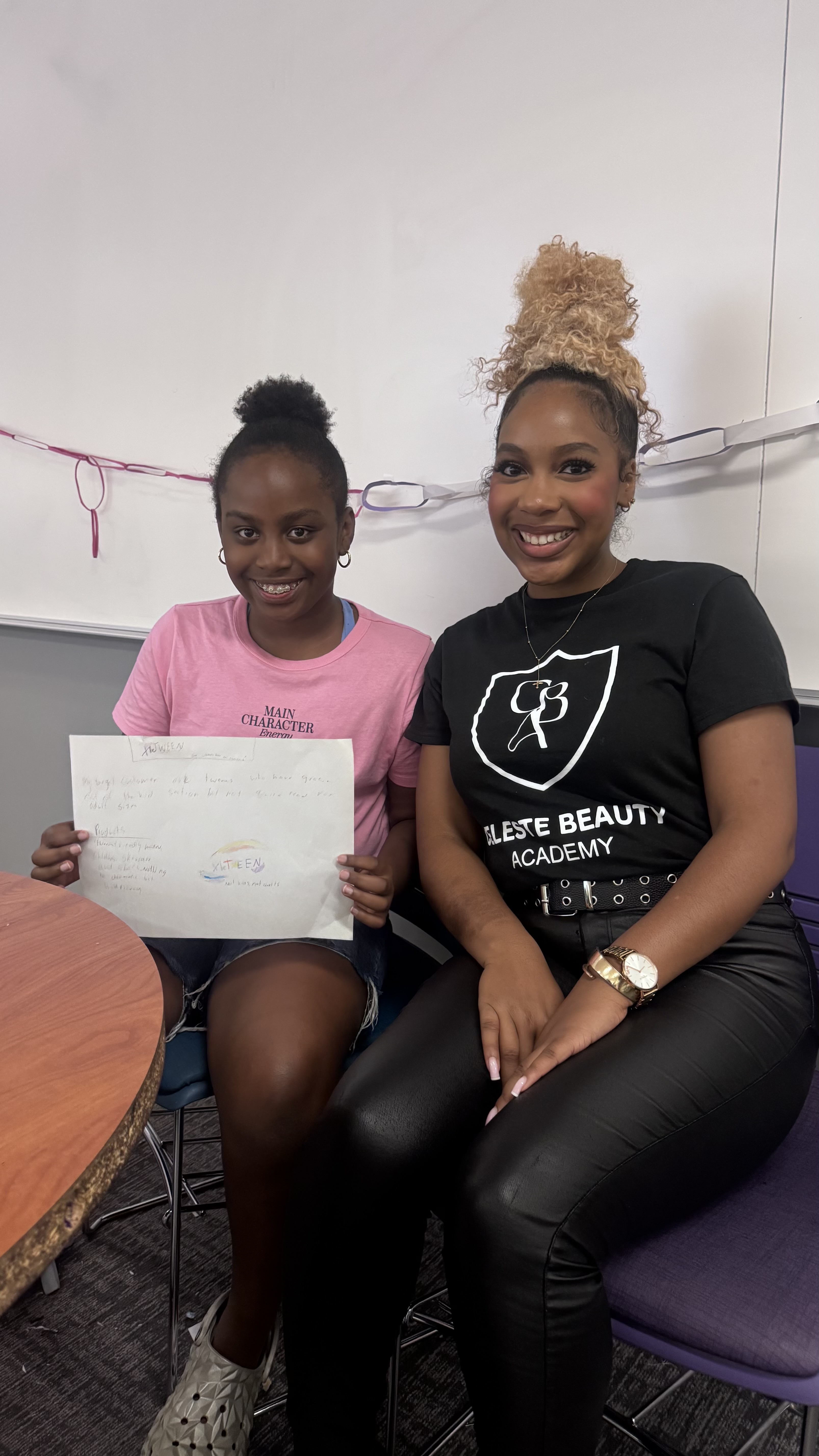 A CBA student and instructor smiling together after a successful workshop session